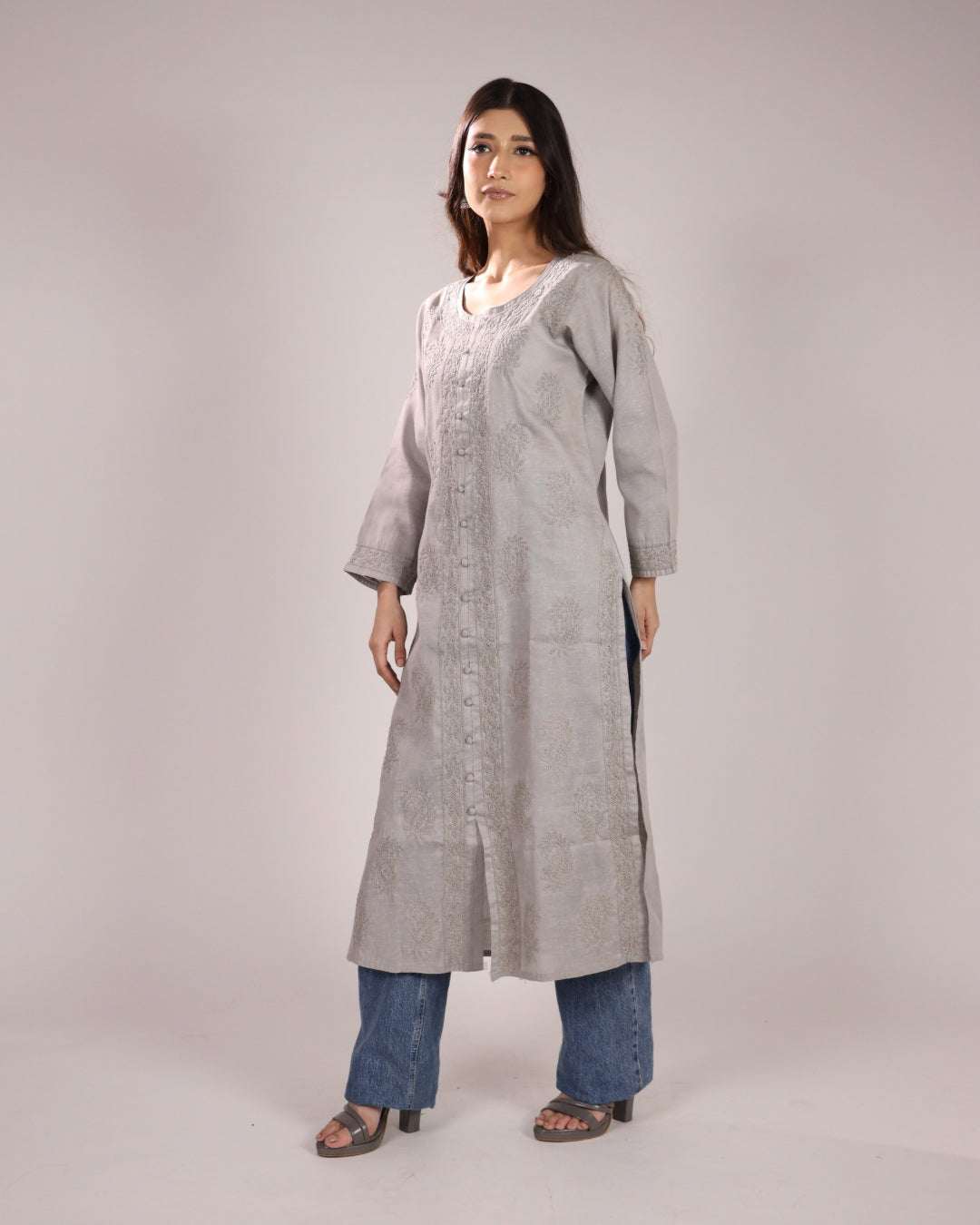 Side view of grey cotton chikan kurta for ladies with a plain background