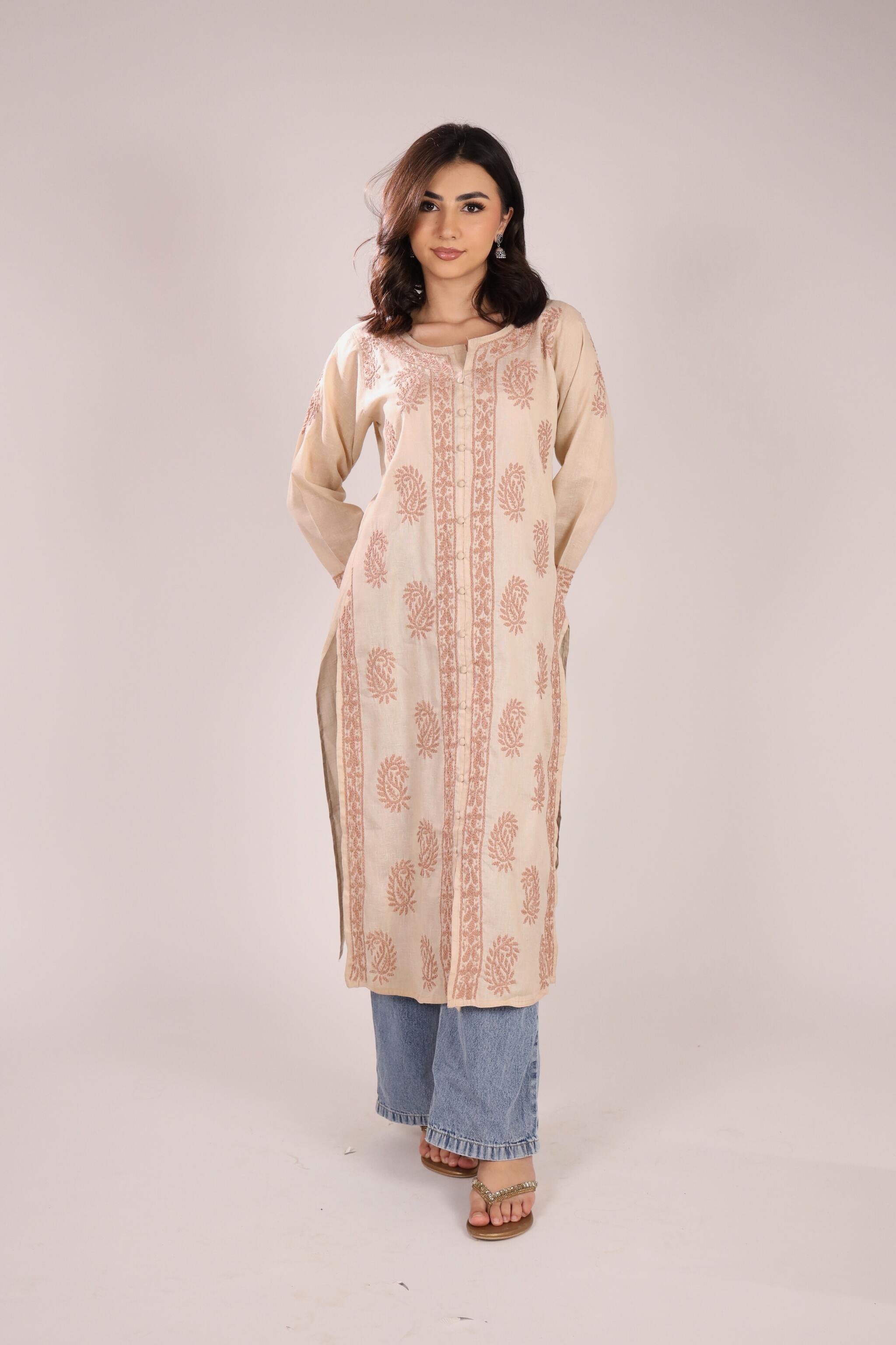 In front view women wearing a Cotton Chikankari Kurta in beige colour with plain background