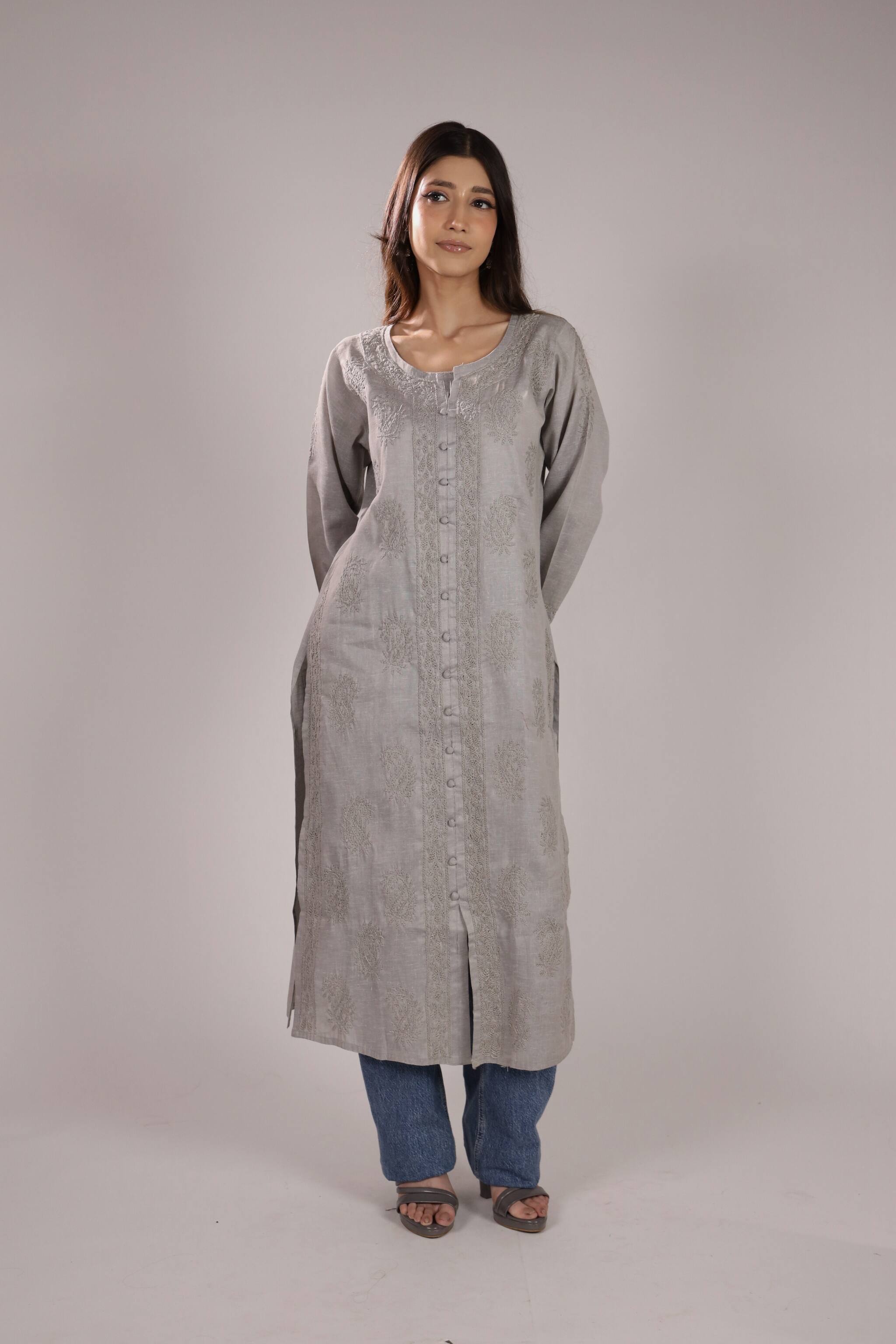 Woman wearing a long Grey Cotton Chikan Kurta For Ladies with a plain background