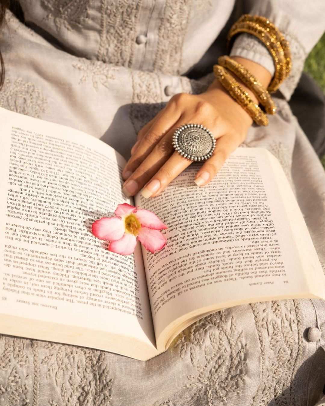 Close up view of grey cotton chikan kurta embroidery with a plain backgroundGrey Cotton Chikan Kurta For Ladies