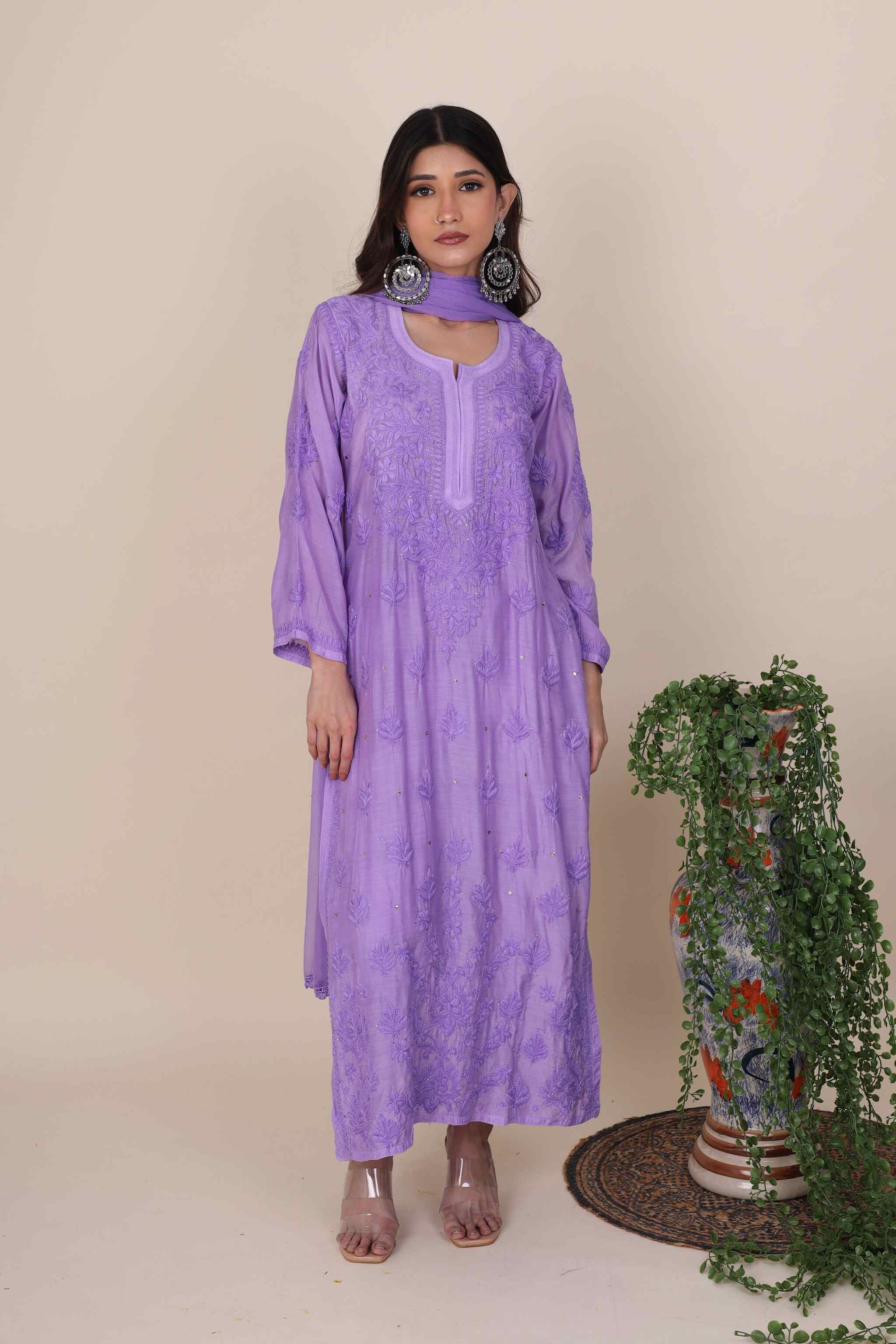 Woman wearing a purple Gulaabo Plum Kurta Set with a neutral background