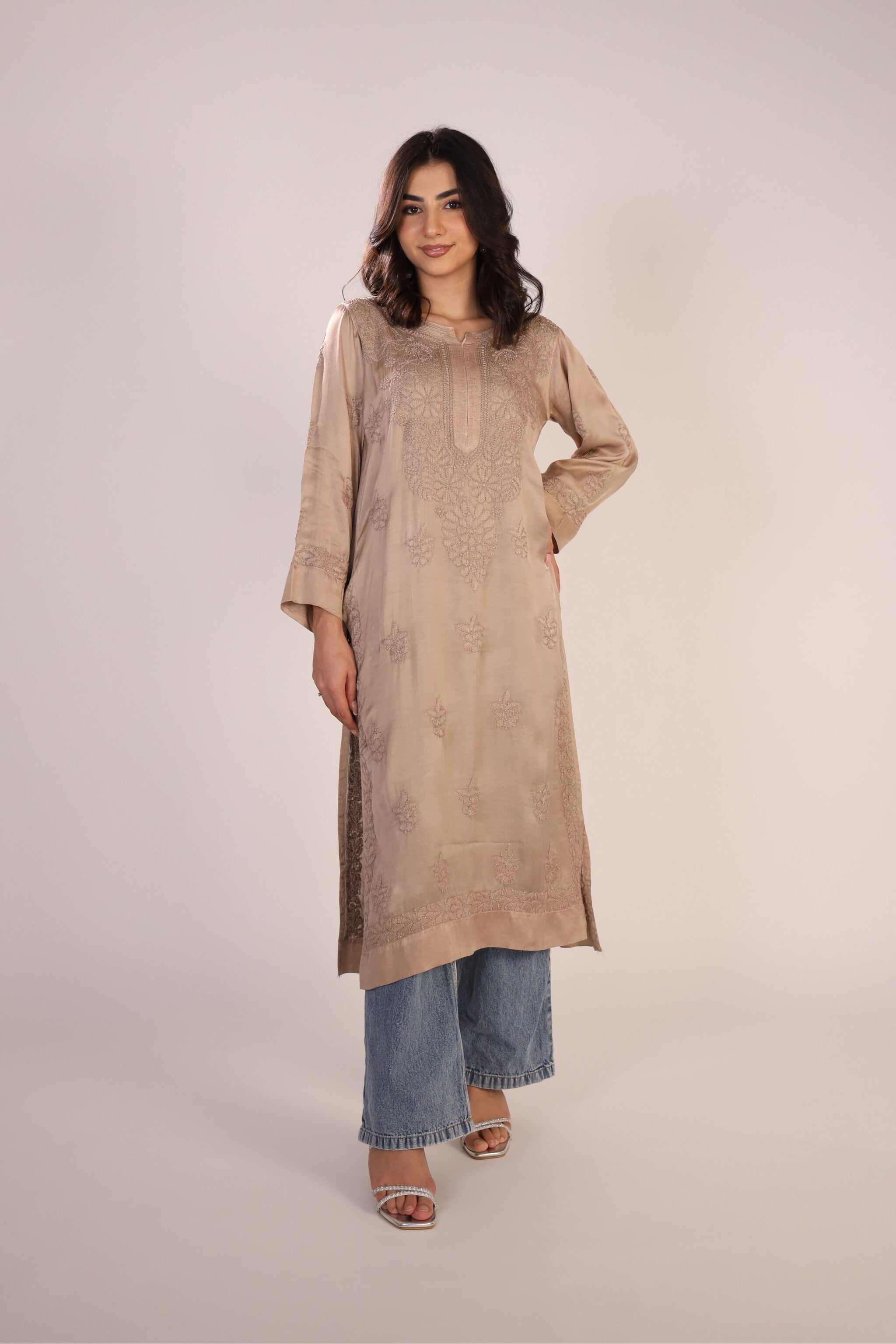 Woman wearing beige Lucknowi Chikankari kurta – front view