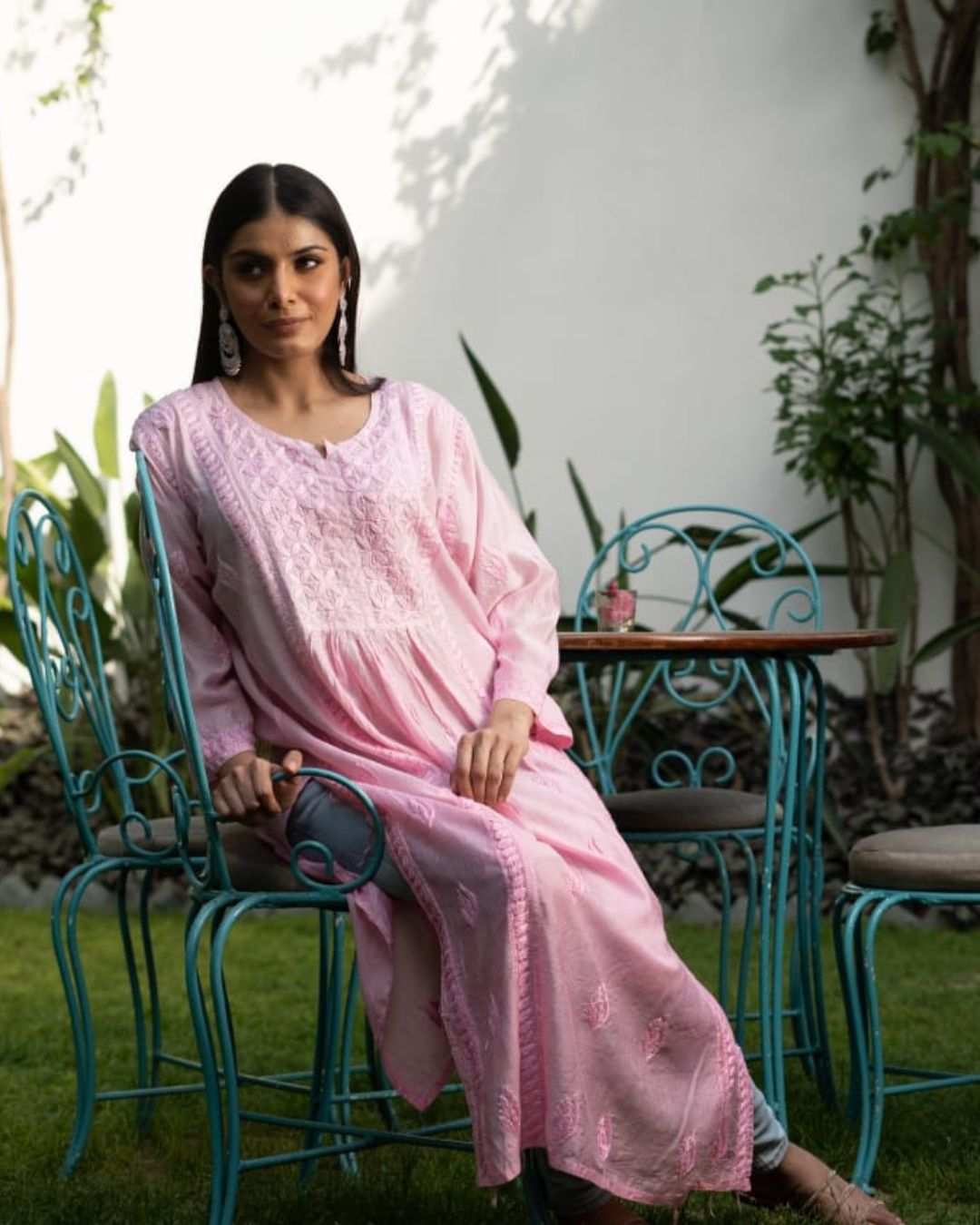 Woman wearing pink Lucknowi kurta in Nyra cut made of luxurious chanderi fabric with full sleeves and 46 inch length