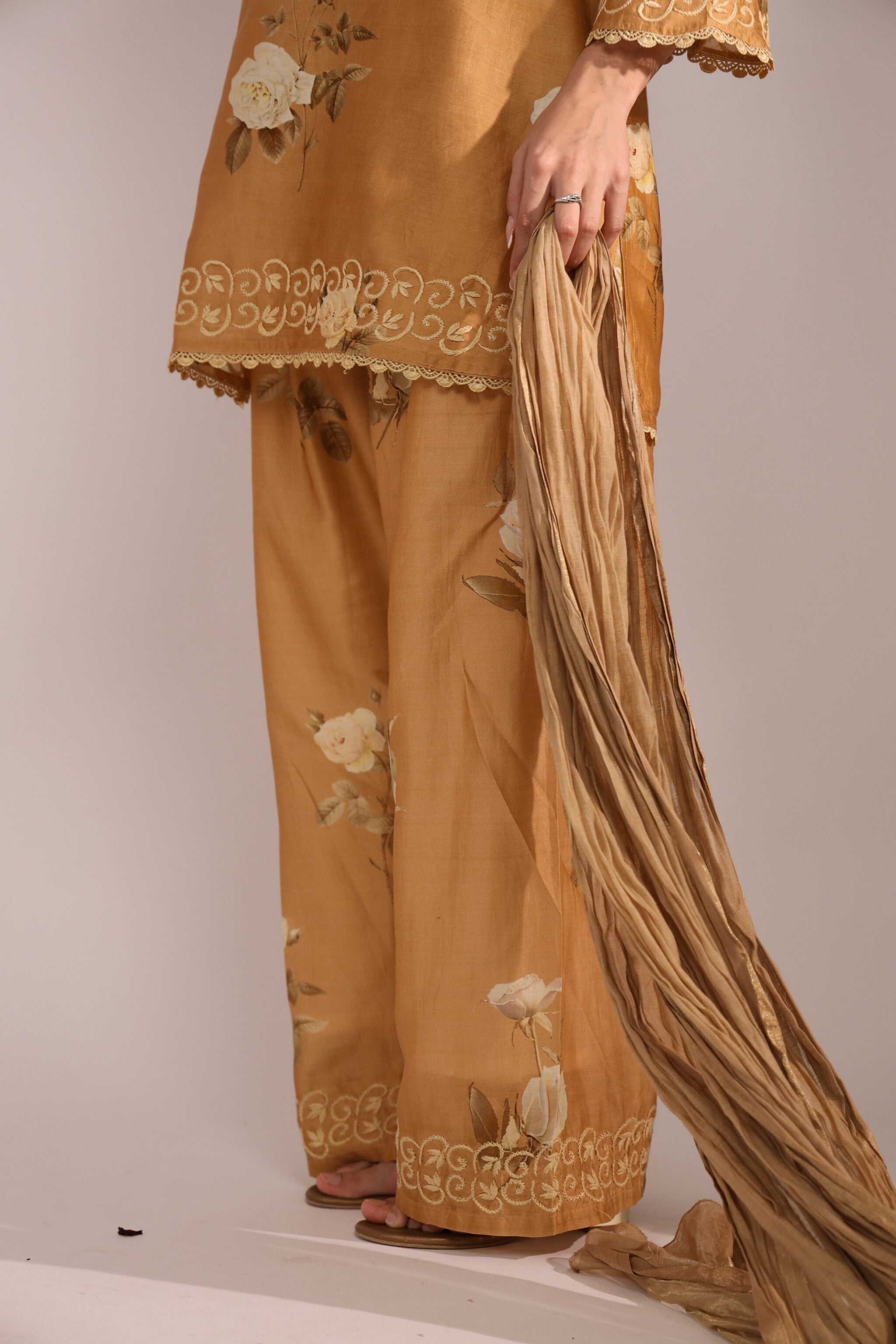 Brown embroidered co ord with a plain background