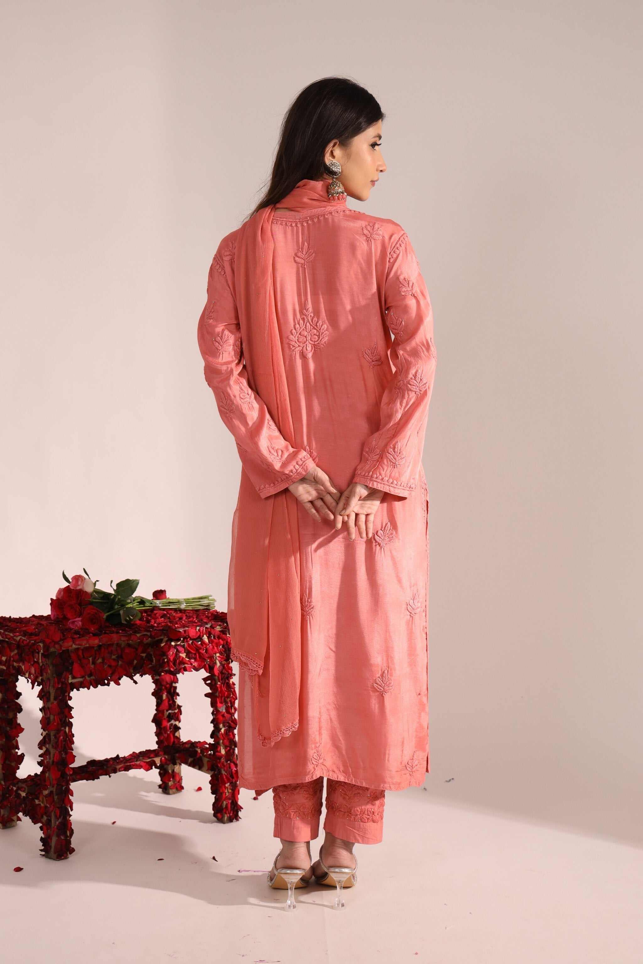 Back view of muslin cotton wedding kurta set with dupatta in soft peach tone.