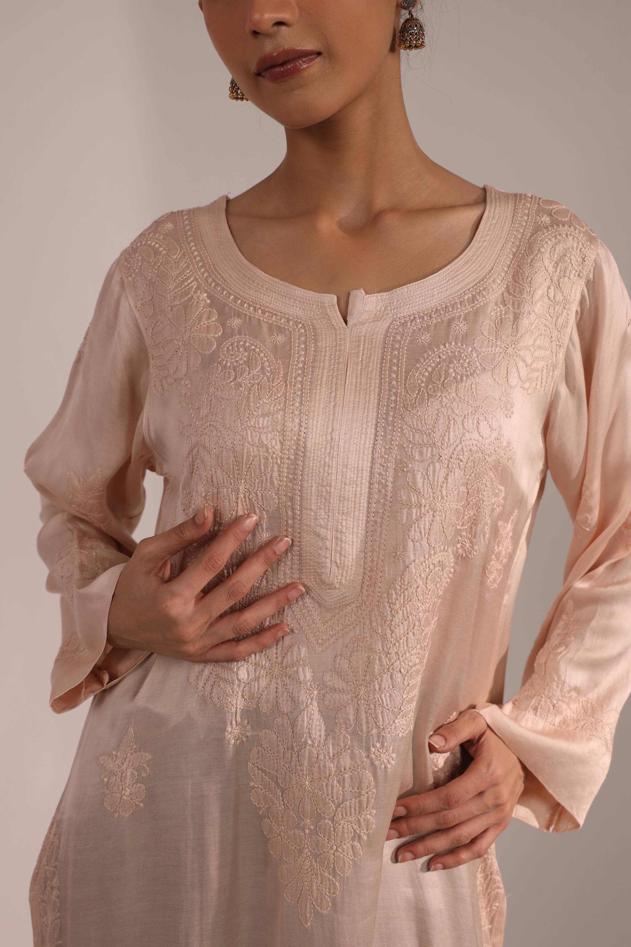 Close-up of embroidery or neckline
Alt Text: Detailed Chikankari embroidery on soft pastel pink kurti – hand-stitched neckline with traditional Lucknowi craftsmanship.