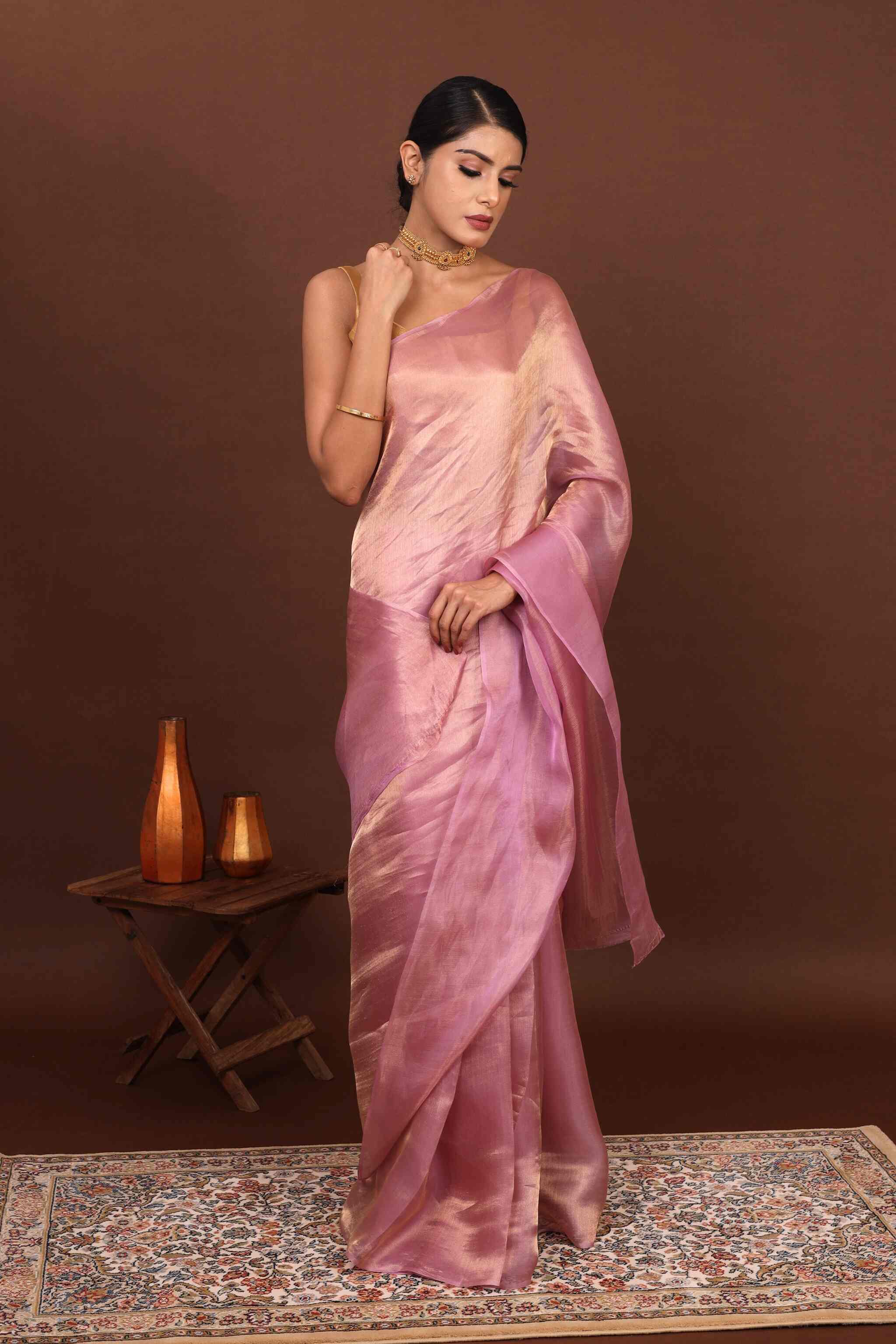 Model draped in Whisper Rose Gold pure tissue slk saree with elegant pose.
