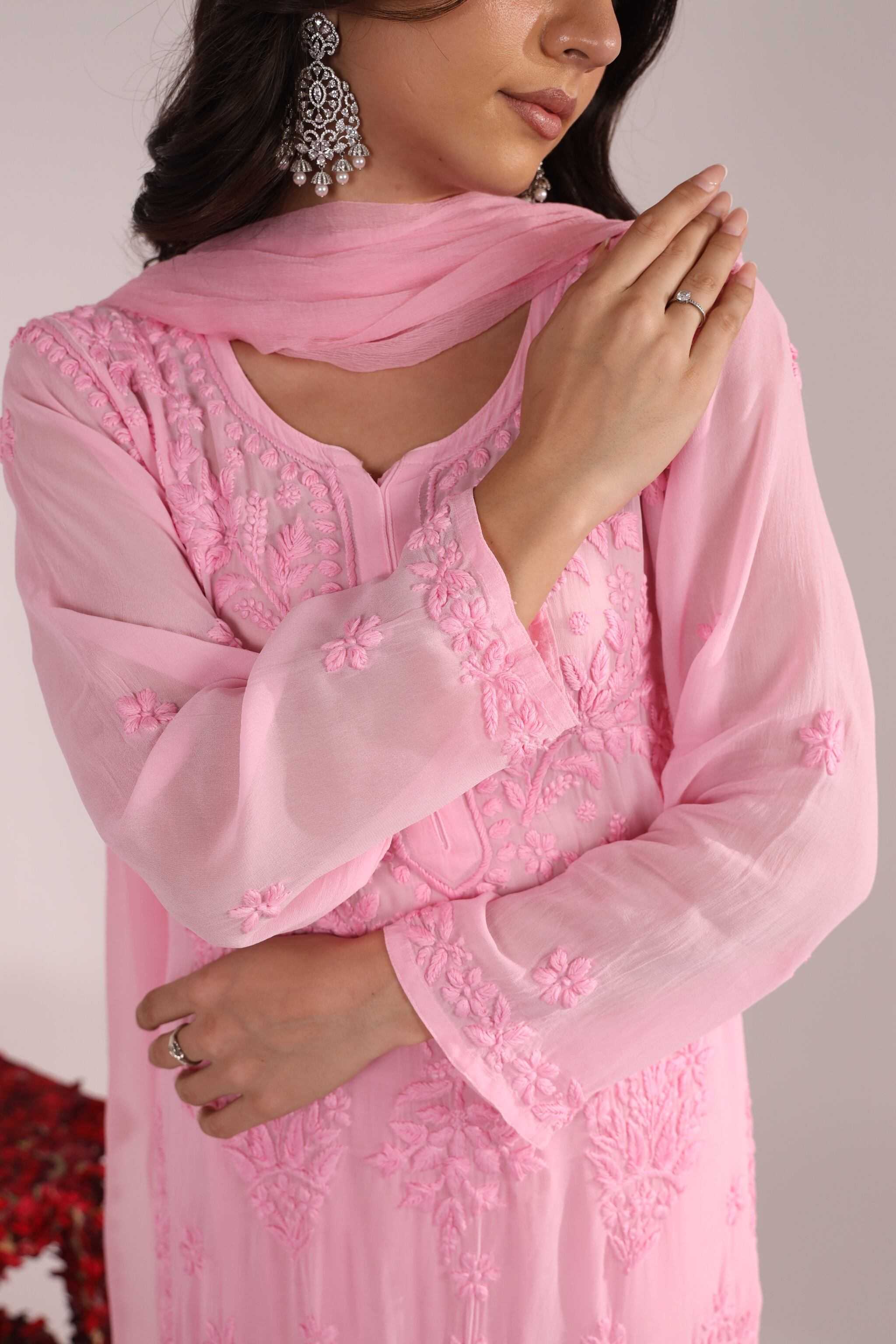 Woman wearing a Pari Embroidered Suit Chikankari with a matching dupatta, against a neutral background.